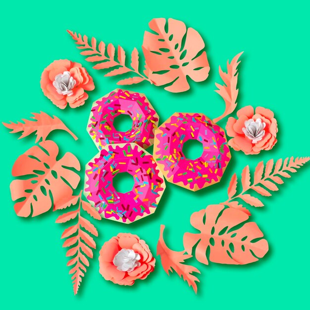 Pink paper donuts in wreath of pink leaves