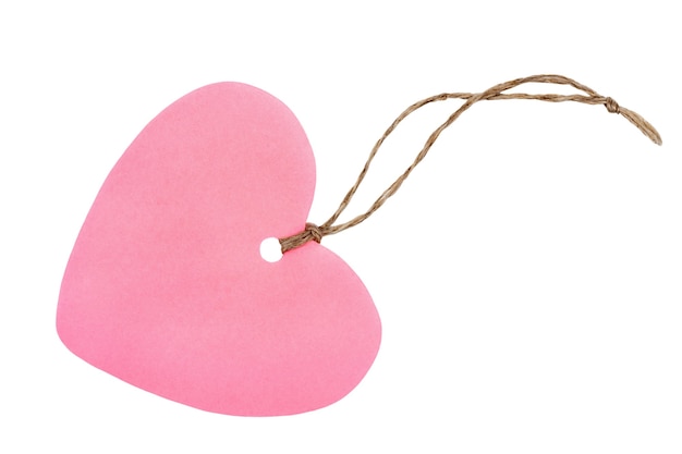 Pink paper heart shaped tag with rope isolated on white background. Valentines day greeting card or gift tag.