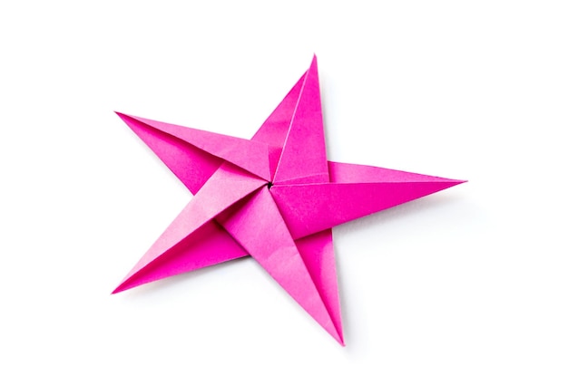 Pink paper star origami isolated on a white background