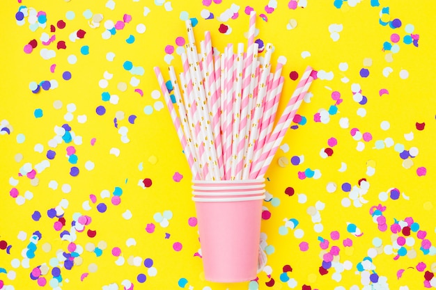 Pink paper straws and pink cups