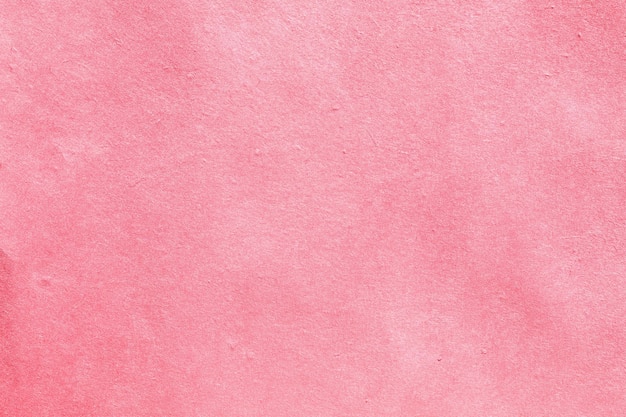 Foto trama di sfondo della superficie della carta rosa