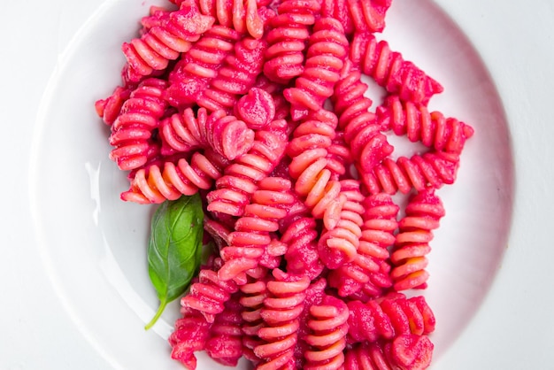 pink pasta beet sauce fusilli vegetable beetroot fresh food meal snack vegetarian food on the table