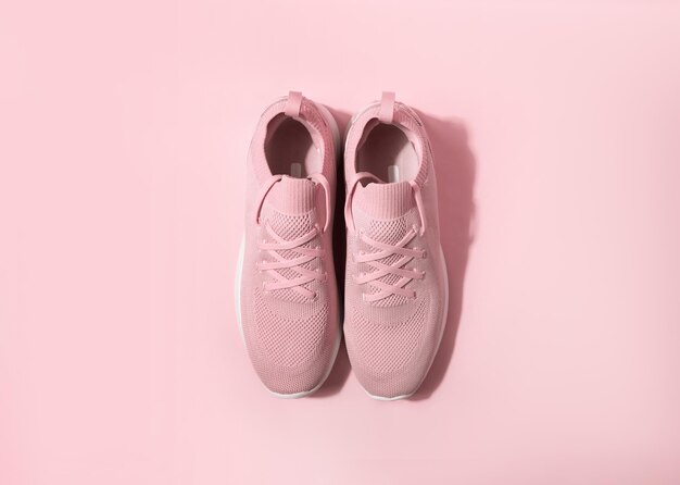 Pink pastel color sneakers on background