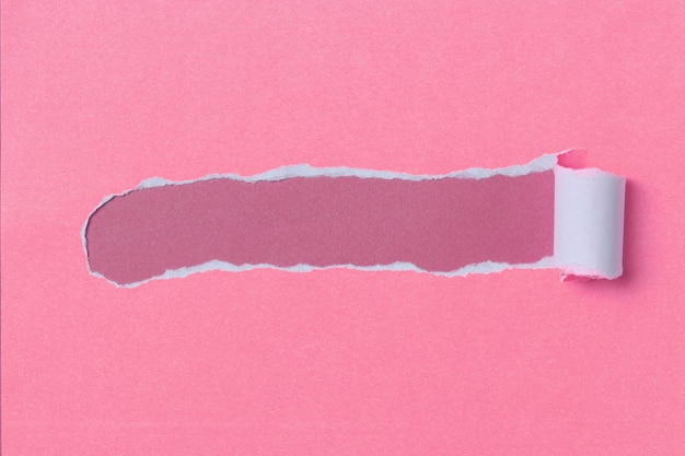 Pink pastel color torn paper with space for text.