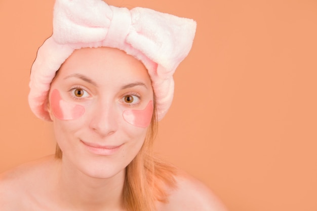 Pink patches under the eyes on a young girl.