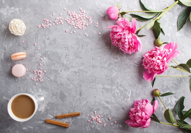 Pink peony flowers and a cup of coffee