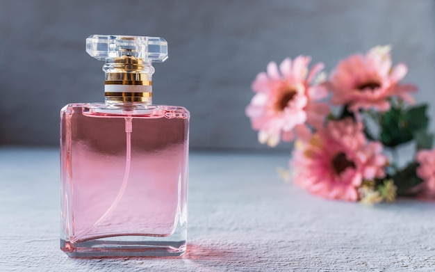 Pink perfume bottle with pink flowers