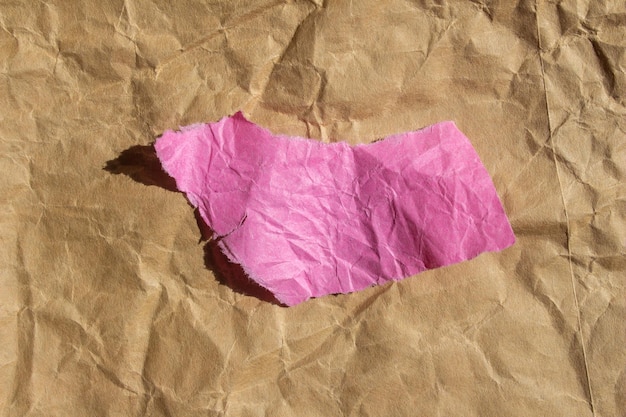 A pink piece of paper that has a pink piece of paper on it.