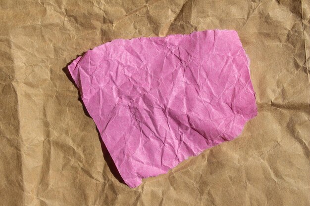 A pink piece of paper that has the word love on it.