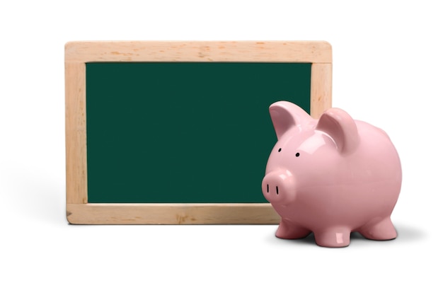 Pink piggy bank and chalkboard