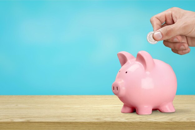 Pink piggy bank on desk