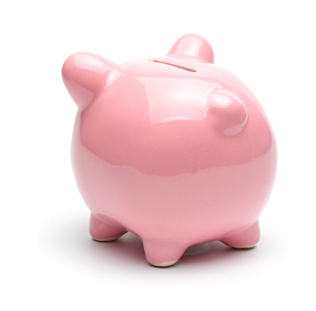 Pink piggy bank isolated on a white surface.