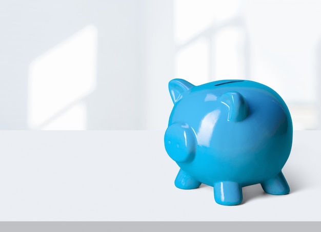 A pink piggy bank on a table