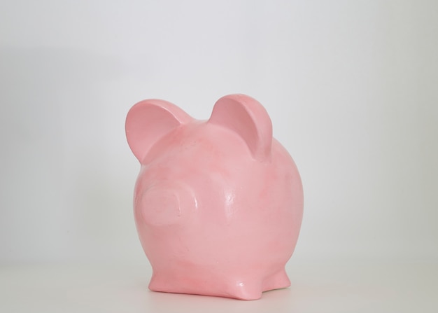 Photo pink piggy bank on a white background
