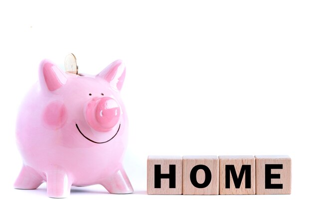 Pink piggy bank and wooden blocks with text