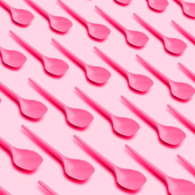 Pink plastic spoons pattern