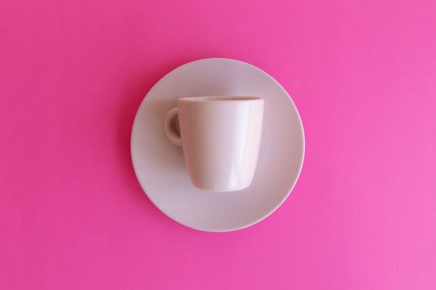 pink plate an cup isolated on pink background