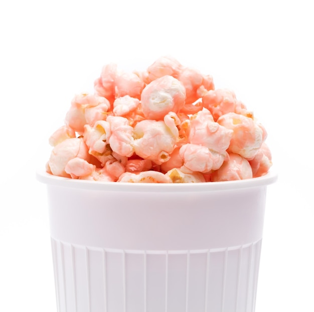 pink Popcorn in striped bucket isolated on white background