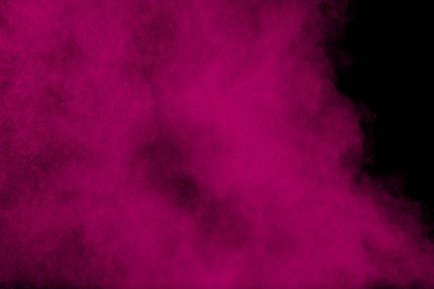 Photo pink powder explosion on black