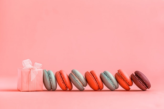 Pink present and Row of french colorful macaroons