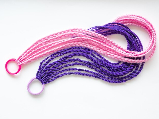 Pink and purple afro kanekolon braids with elastic band hair accessory