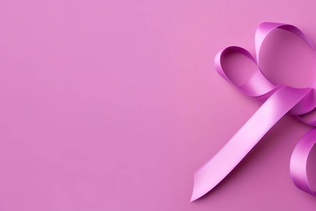 Pink or purple ribbon as breast cancer or epilepsy awareness symbol and copy space World cancer day