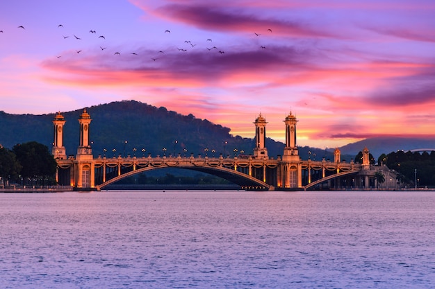 Pink and purple sky over the calm sea