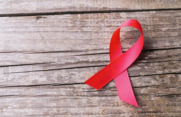 Photo pink ribbon awareness for world aids day and national hiv/aids and aging awareness month concept campaign