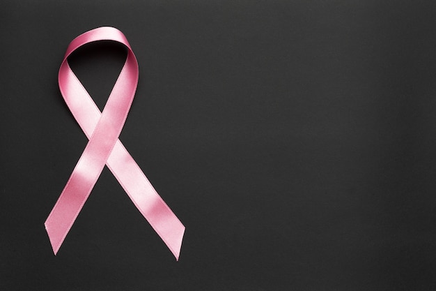 Pink ribbon on a black background