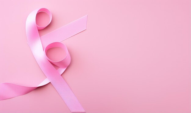 Pink ribbon on pink background