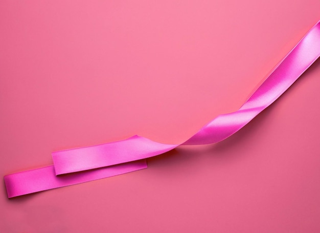 Photo pink ribbon on pink background