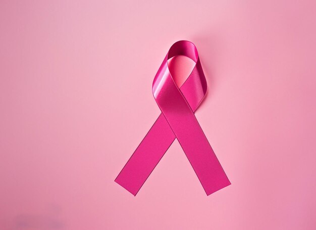 Photo pink ribbon on pink background