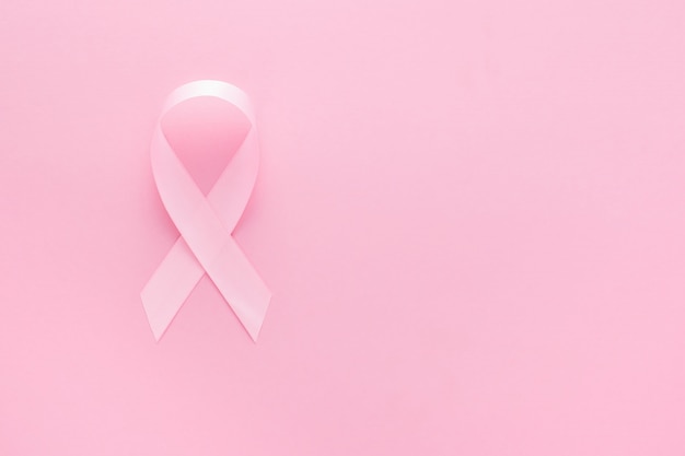 Pink ribbon on a pink surface