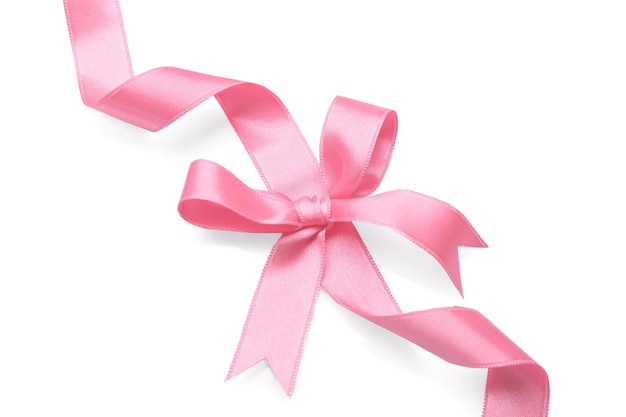 Photo pink ribbon with bow on white background