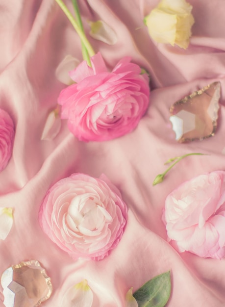 Pink rose flowers on soft silk wedding holiday and floral background styled concept