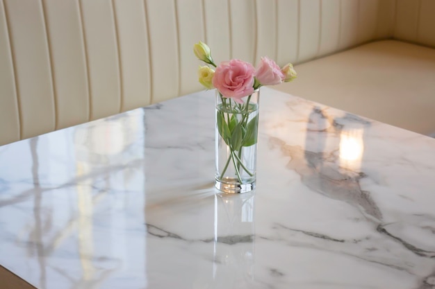 Pink rose in vase on the table