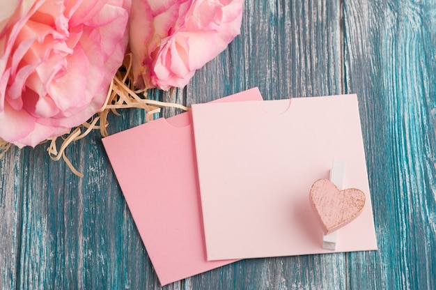 Pink roses and colorful envelopes