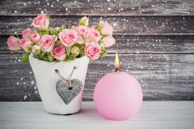 Pink roses in concrete pot