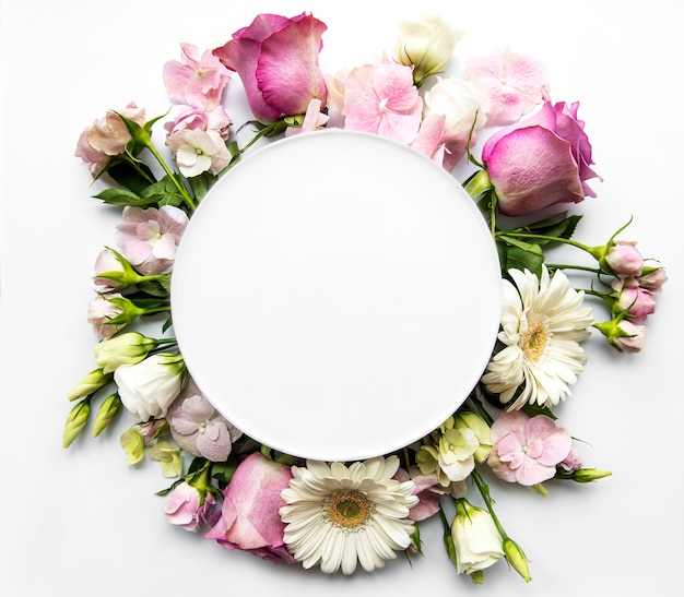 Pink roses and  flowers in round frame