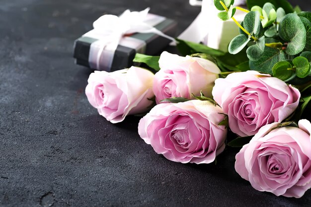 Pink roses and a gift box 