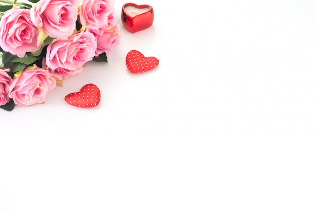 Pink roses and heart on white background