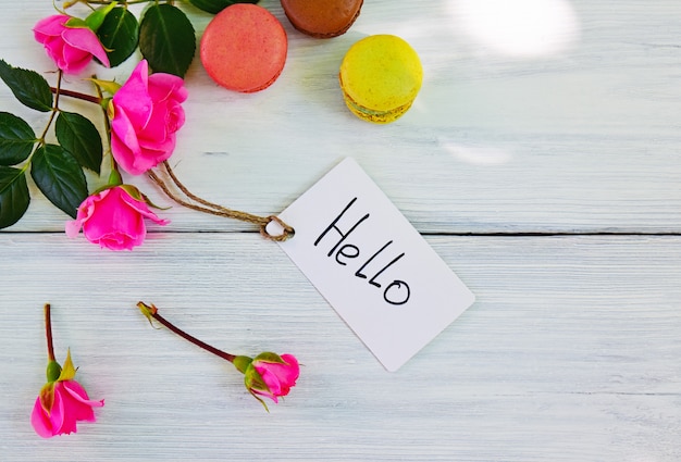 Photo pink roses with inscription label and hello