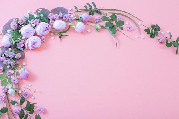 Pink roses with leaves on paper background