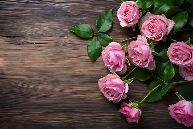 Pink roses on a wooden background