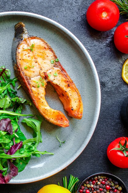 pink salmon steak fried and salad