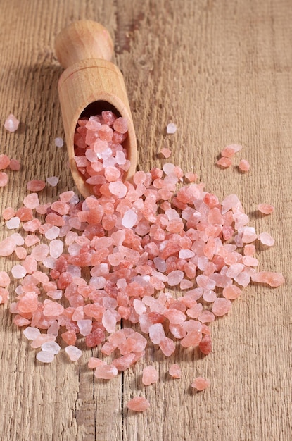 Pink salt in wooden scoop