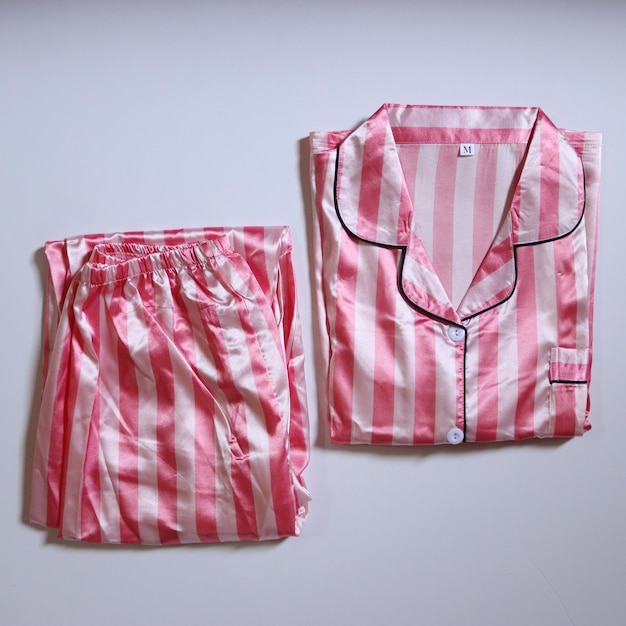 Premium Photo | Pink satin pajamas set