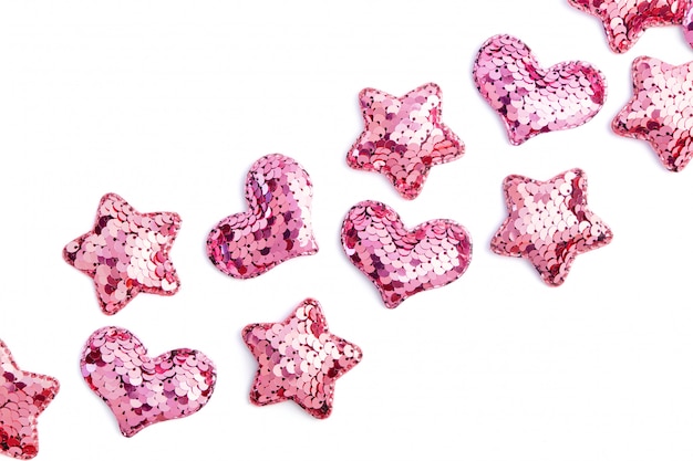 Pink sequin hearts and stars on white