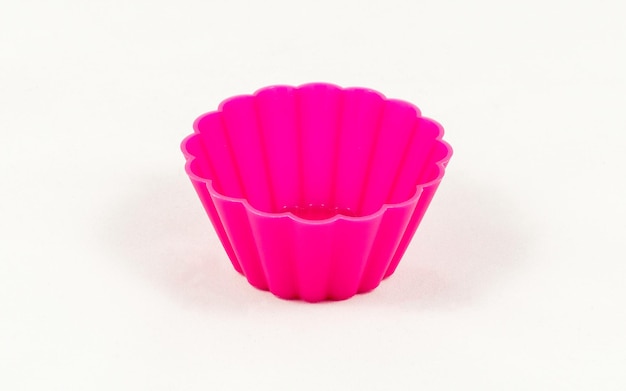 Pink silicone cake cups isolated on white background