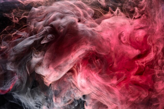 Pink smoke on black ink background, colorful fog, abstract swirling touch ocean sea, acrylic paint pigment underwater